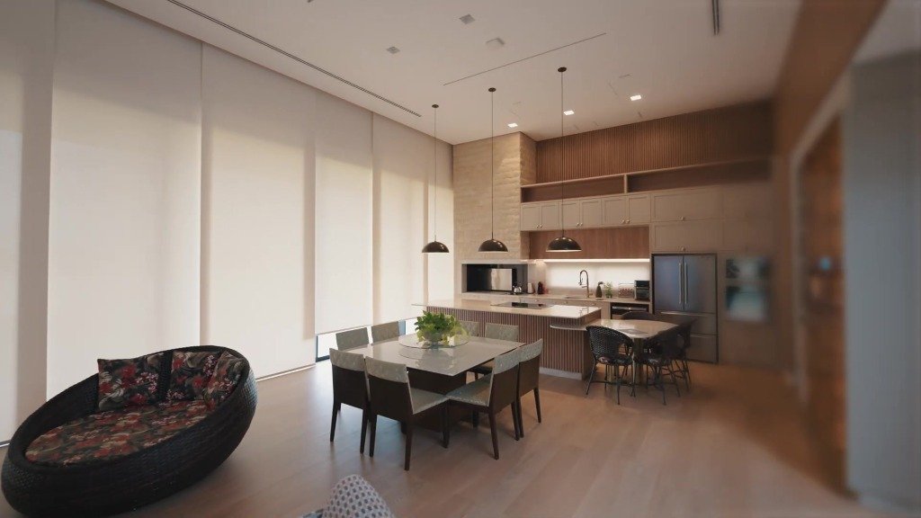 Área gourmet integrada com iluminação e cortinas automatizadas